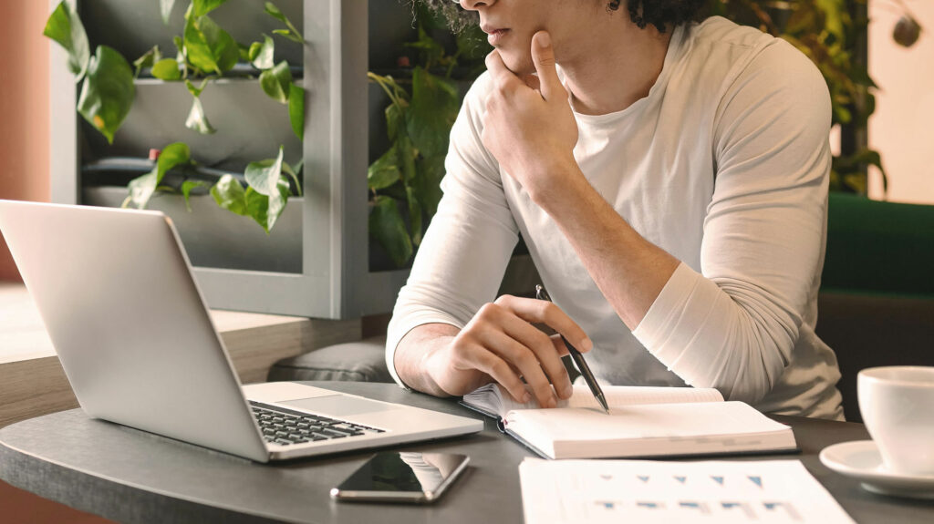image of person writing a pitch